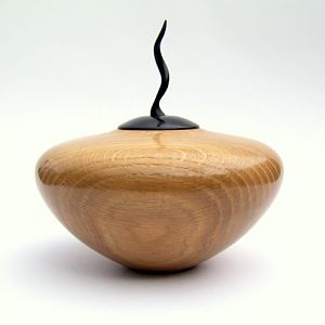 Oak hollow lidded form with Anjan lid and carved finial