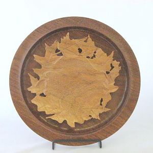 Carved Cherry platter on a walnut platter
