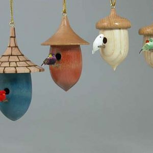 A collection of small bird house ornaments