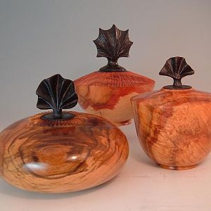 Three Urns with Carved Lids