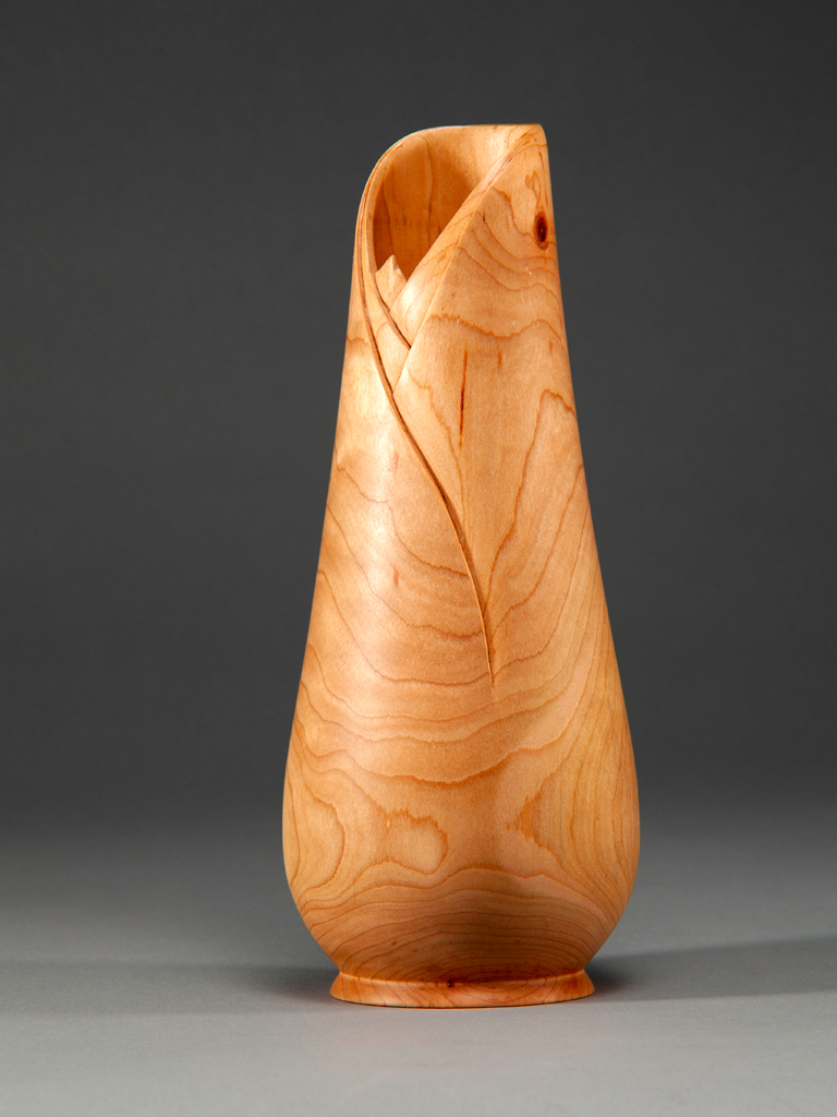 11.5" Cherry Vase turned and carved.