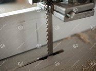 bandsaw-blade-close-up-shot-wood-dust-chips-blured-background-bandsaw-blade-close-up-shot-wood...jpg