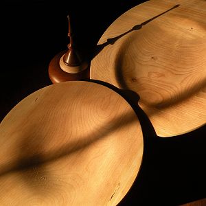 Two cherry platters and a small lidded vessel