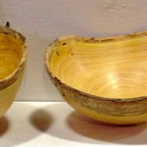 Set of yellow wood natural edge bowls
