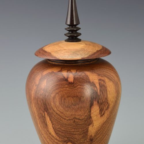 Vessel with ebony finial on raised collar