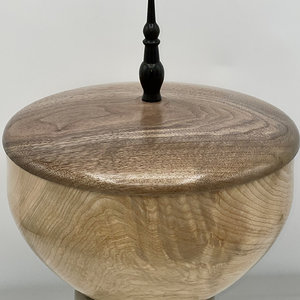 Maple vessel with a walnut lid