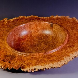 Winged burl bowl with natural edge