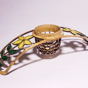 Winged floating bowl with pierced flower