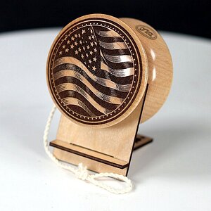 USA flag and maker's mark engraved onto hard maple one-piece yo-yo