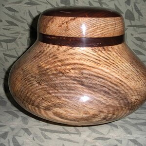 Oak and Walnut box  An Experiment using a large plastic  peanut jar as a screw connection.  8 1/2 inches diameter, 7 inches tall