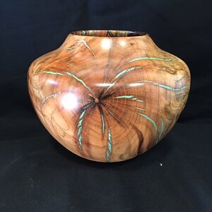 Pistachio hollow form with turquoise inlay