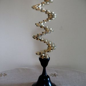 Solid brass spiral staircase with blackwood base