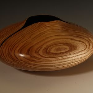 Hollow form with carved rim in Ash