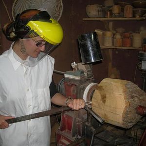 student turning an olive wood bowl