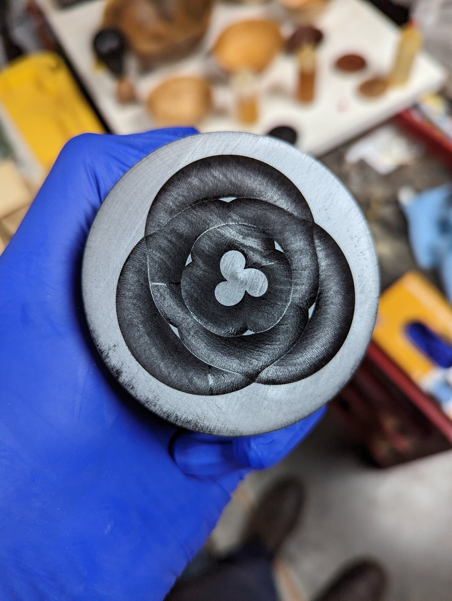 Bottom of a blackwood box ornamented with the GP-3 rosette