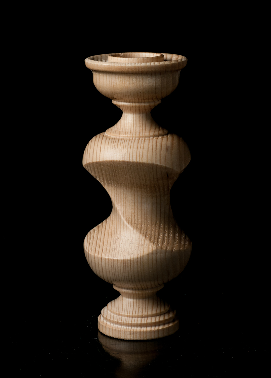 Candlestick with a half-twist section