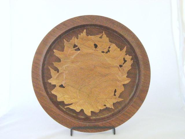 Carved Cherry platter on a walnut platter