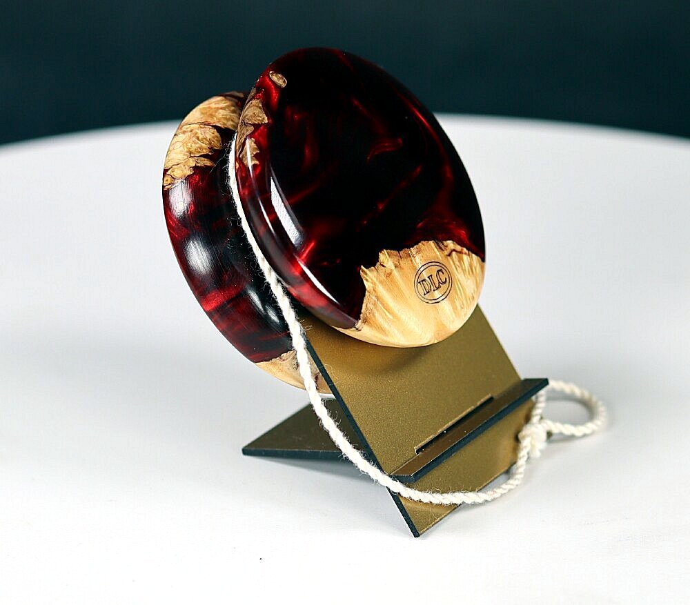 Cast acrylic and boxelder burl yo-yo.