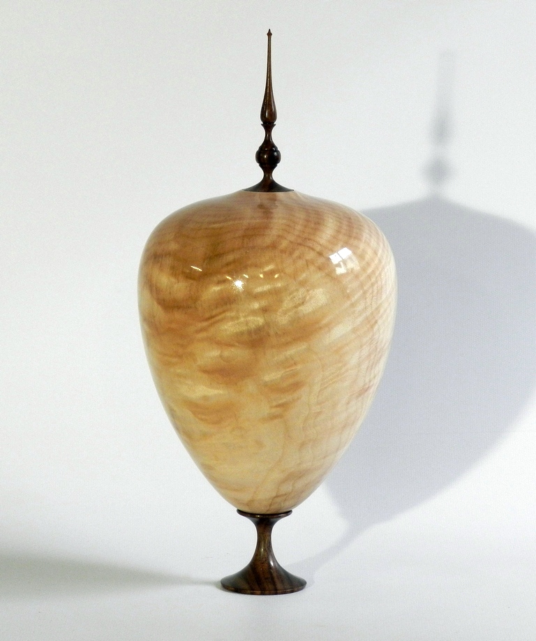 Elevated hollow form with finial