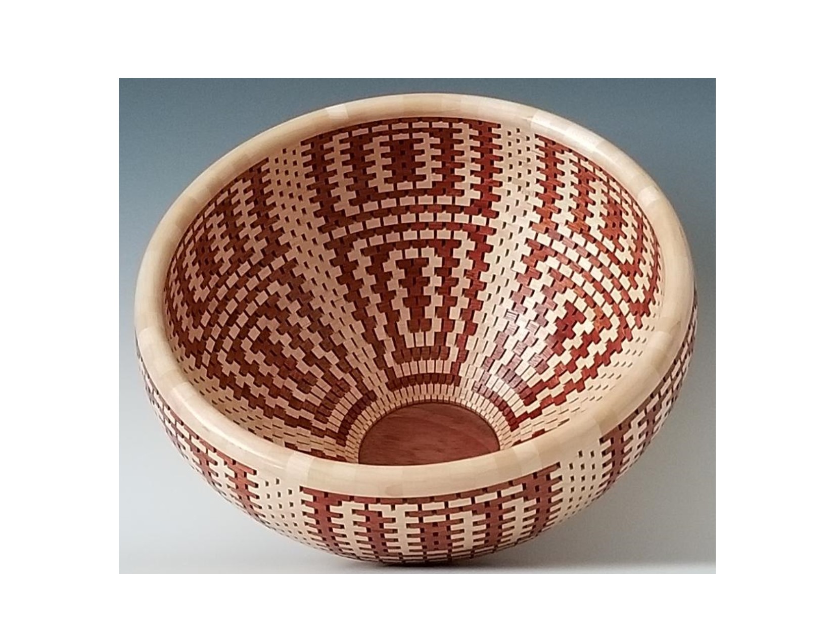 Latest Charity Donation, Aztec Inspired #2 Inside. The bowl is made of Bloodwood and Maple. It is 34 layers of 72 pieces for a total of 2448 pieces.