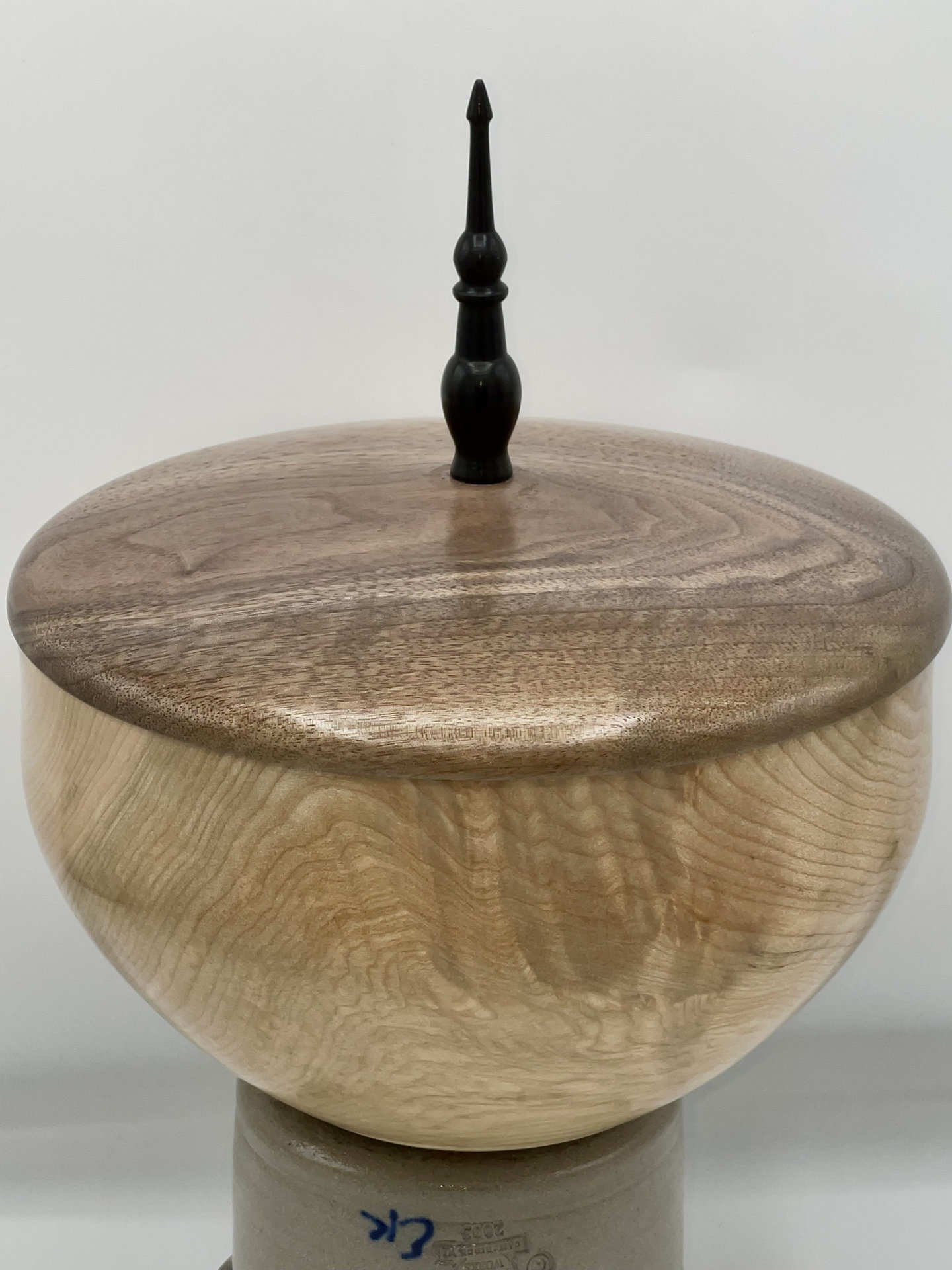 Maple vessel with a walnut lid