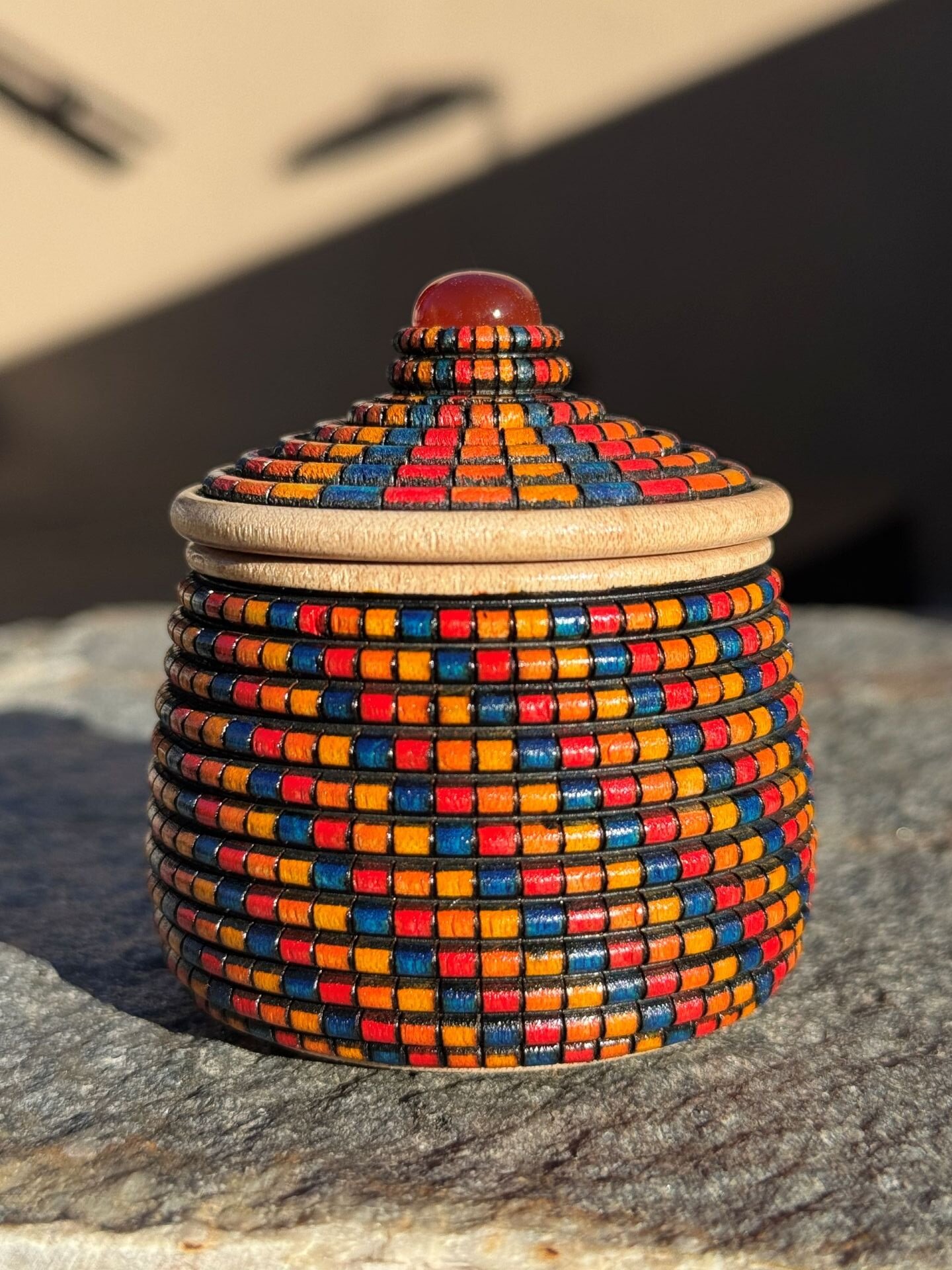 Red, Orange, Yellow and Blue Zulu Herb Basket Illusion Box with Carnelian Cabochon (side view)