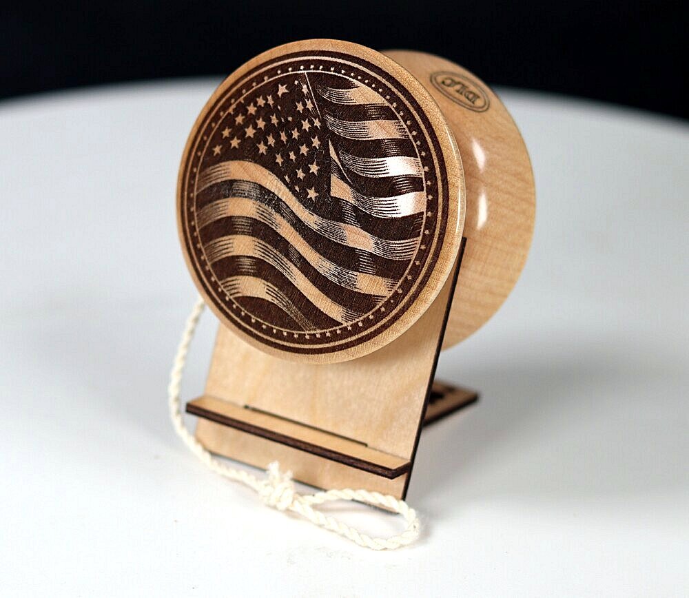 USA flag and maker's mark engraved onto hard maple one-piece yo-yo