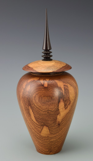 Vessel with ebony finial on raised collar