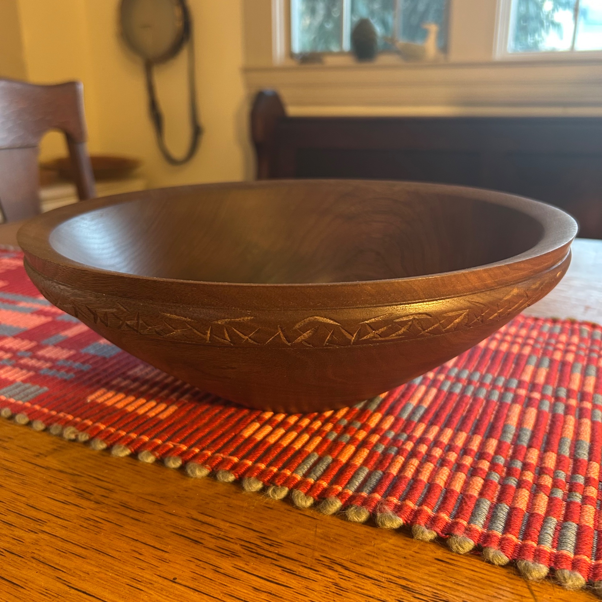 Walnut bowl with beaded and carved detail