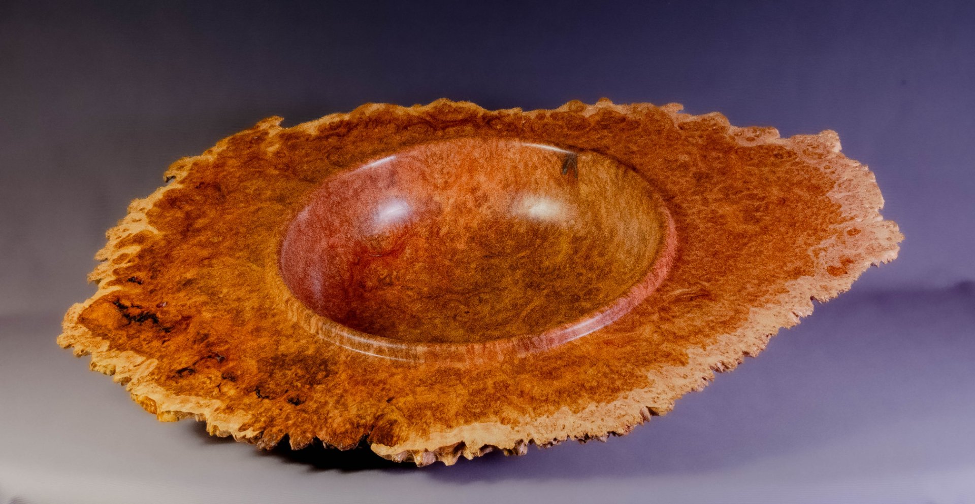 Winged burl bowl with natural edge