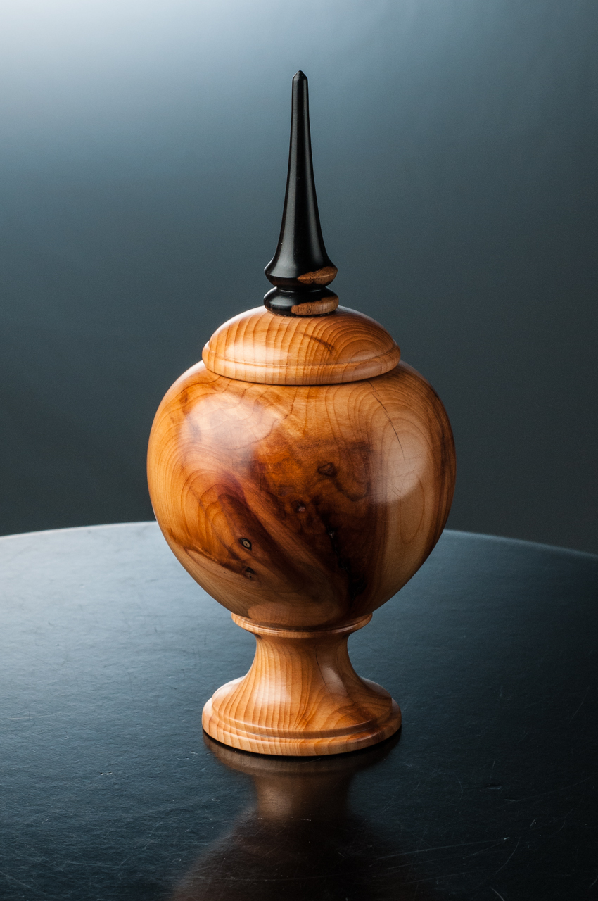 Yew lidded box with a simple African blackwood finial, 3” wide & 6 ⅝” tall